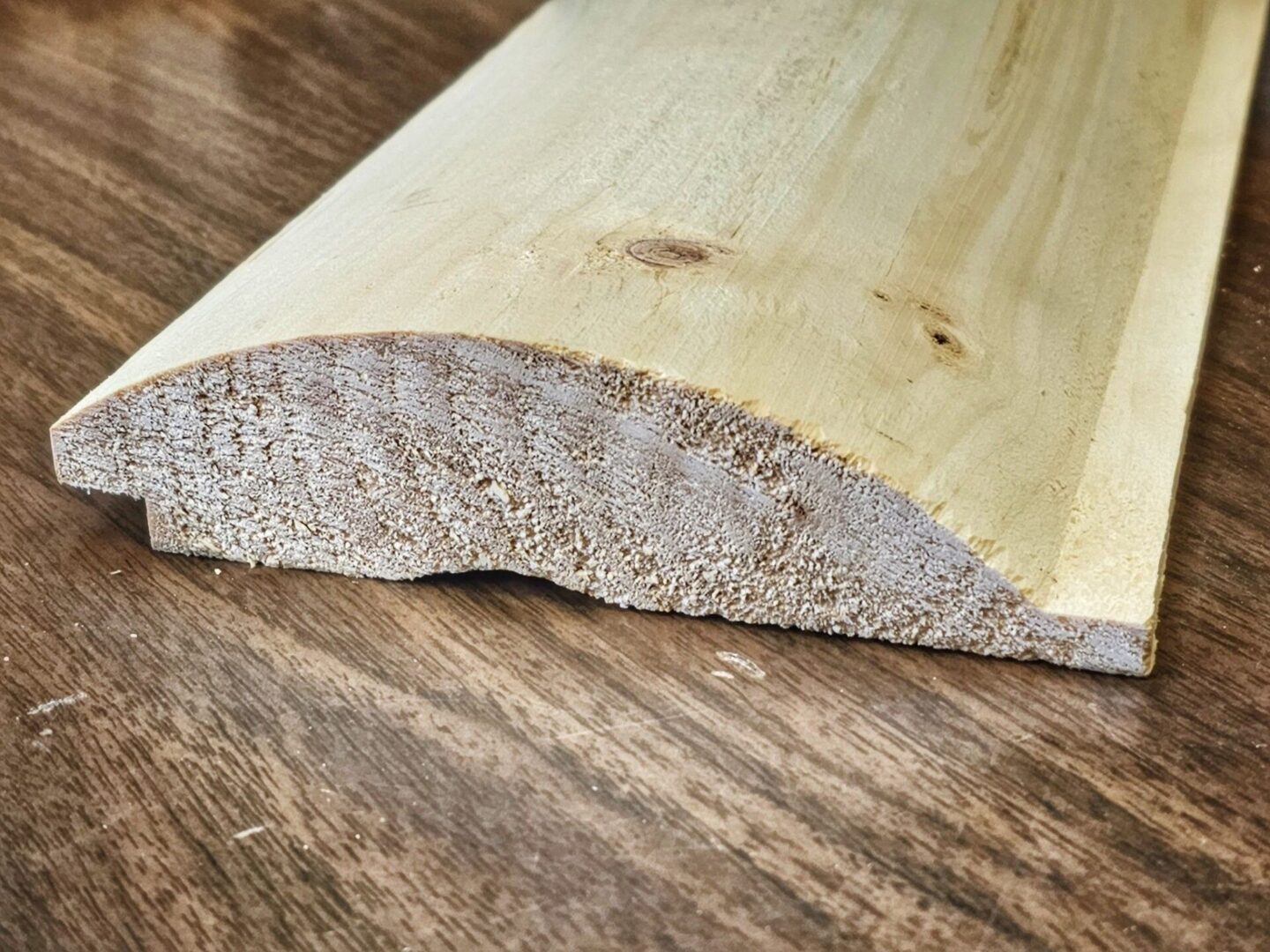 A closeup look of a wood piece kept on a wooden floor